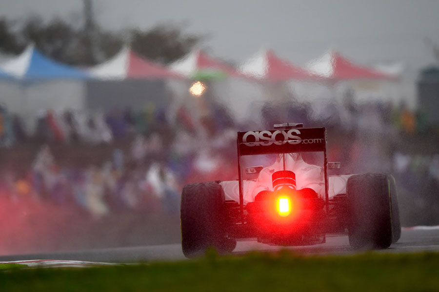 Jenson Button on track on intermediate tyres