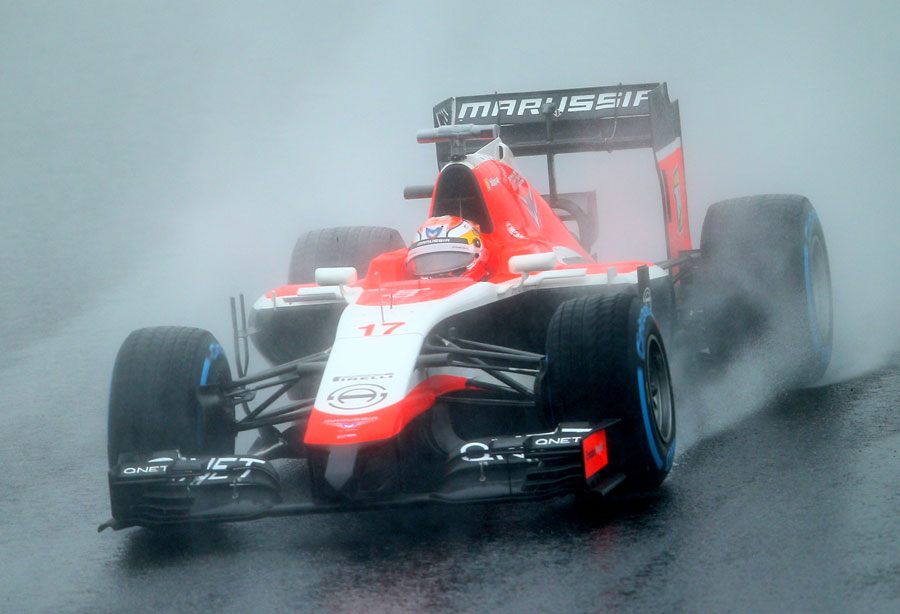 Jules Bianchi drives through the spray in the opening laps