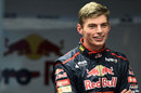 Max Verstappen smiles in the Toro Rosso garage during his seat-fitting