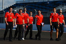 Alexander Rossi walks the track with the Marussia team