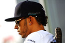 Lewis Hamilton conducts an interview in the paddock