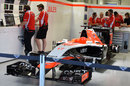 Jules Bianchi's unused car sits in the Marussia garage as a mark of respect