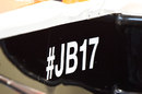 The hashtag displayed on the side of Jules Bianchi's empty Marussia in the garage