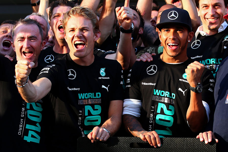 Nico Rosberg and Lewis Hamilton celebrates Mercedes' constructors' title success