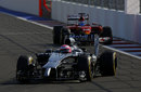 Jenson Button comes under pressure from Ferrari's Fernando Alonso