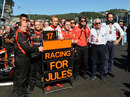 Max Chilton, Marussia and Charlie Whiting pose with a sign in support of Jules Bianchi