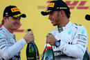Nico Rosberg and Lewis Hamilton acknowledge each other on the podium