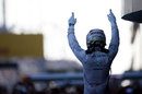 Lewis Hamilton celebrates his fourth straight victory in parc ferme