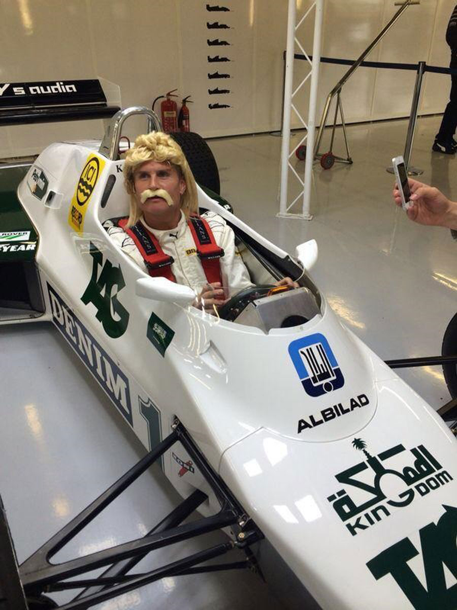 David Coulthard dons a Keke Rosberg wig and moustache while driving the Finn's 1982 Williams