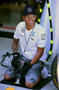 Lewis Hamilton tries his hand at being a pit stop mechanic