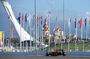 Daniel Ricciardo powers past a row of flags during Friday practice