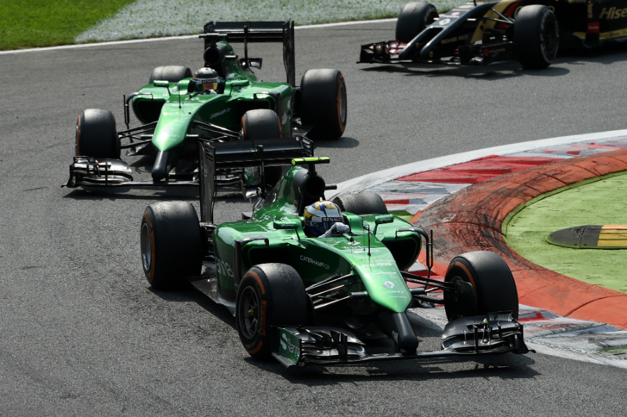 Marcus Ericsson leads Caterham team-mate Kamui Kobayashi through the first chicane