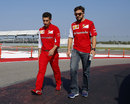 Fernando Alonso conducts his track walk with race engineer Andrea Stella