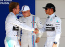 Lewis Hamilton congratulates Nico Rosberg on his pole position in parc ferme
