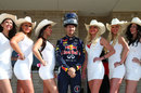 Sebastian Vettel poses with cowgirls on the morning of the race