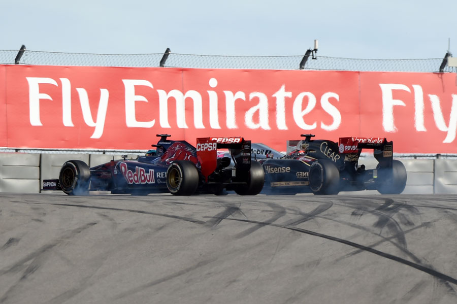 Jean-Eric Vergne clouts Romain Grosjean as he passes him at Turn 1