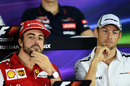 Fernando Alonso and Jenson Button look on in the Thursday press conference