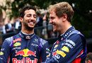 Red Bull team-mates Daniel Ricciardo and Sebastian Vettel share a joke at a promotional event