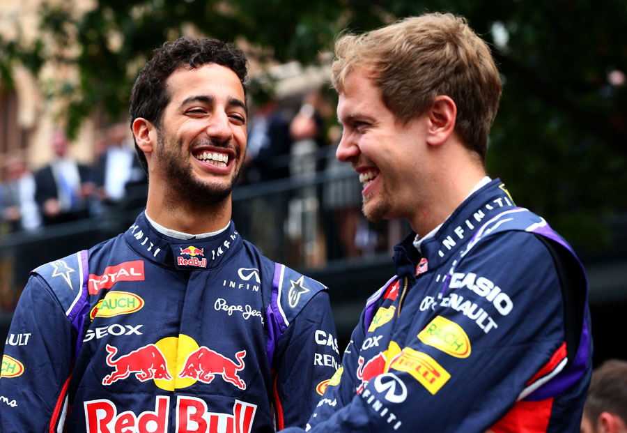 Red Bull team-mates Daniel Ricciardo and Sebastian Vettel share a joke at a promotional event