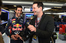 Daniel Ricciardo and actor Keanu Reaves enjoy a laugh in the Red Bull garage