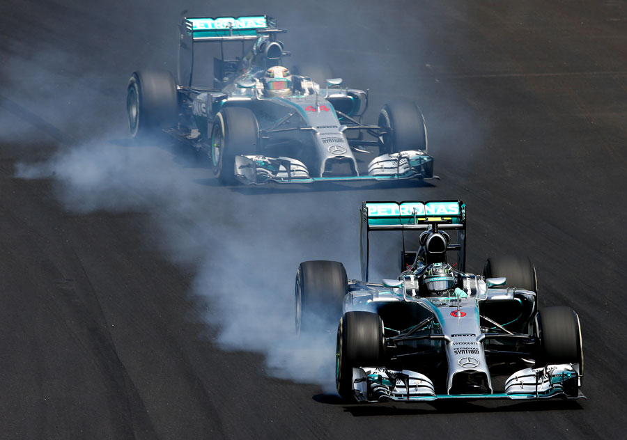 Nico Rosberg locks up under pressure from Lewis Hamilton