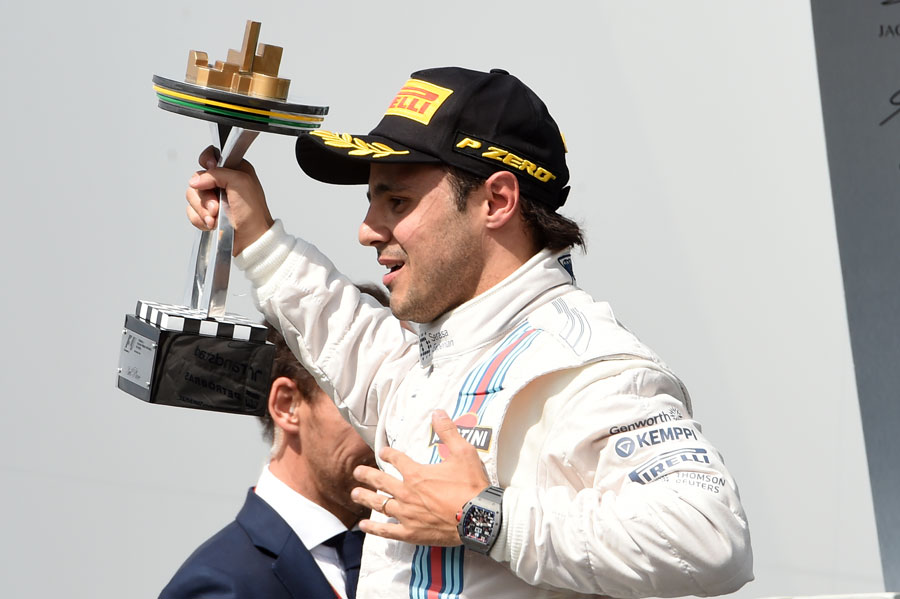 Felipe Massa celebrates with his home crowd on the podium