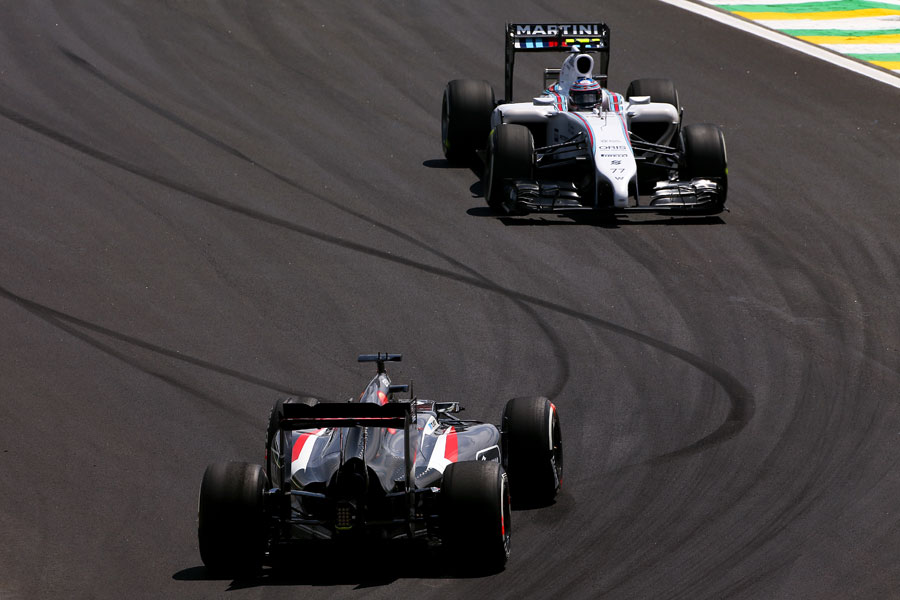 Valtteri Bottas slows as he approaches Adrian Sutil after spinning his Sauber