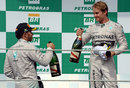 Title contenders Nico Rosberg and Lewis Hamilton acknowledge each other on the podium