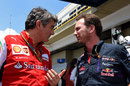 Marco Mattiacci and Christian Horner discuss matters in the paddock