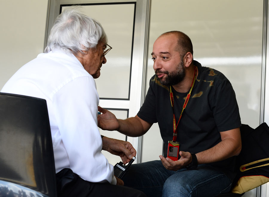 Bernie Ecclestone talks with Lotus boss Gerard Lopez
