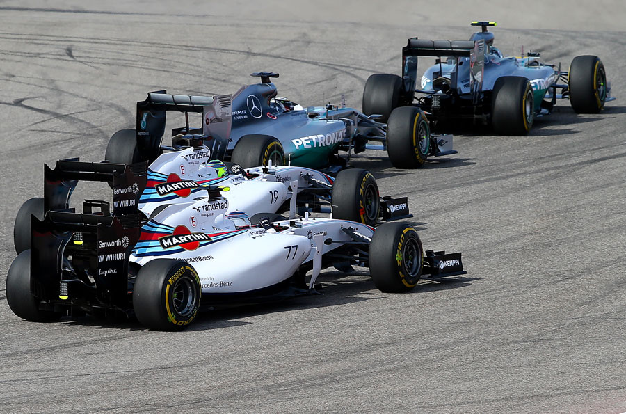 Valtteri Bottas and Felipe Massa vie for position behind the Mercedes