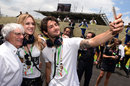 Brazilian footballer Alexandre Pato poses for a selfie with Bernie Ecclestone