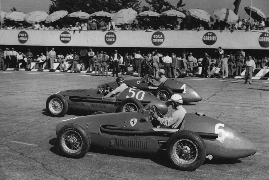 Alberto Ascari (No. 4), Juan Manuel Fangio (No. 50) and Giuseppe Farina (No. 6) line up on the grid 