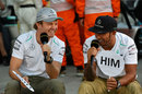 Mercedes team-mates Nico Rosberg and Lewis Hamilton laugh during an interview