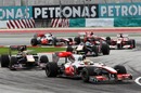 Lewis Hamilton leads a gaggle of cars