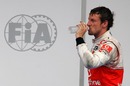 Jenson Button re-hydrates after the race