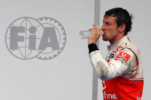 Jenson Button re-hydrates after the race