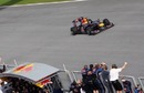 The Red Bull Racing team celebrates on the pit wall