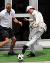 Nico Rosberg plays football with his trainer