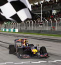 Sebastian Vettel takes the chequered flag