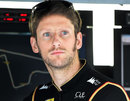 Romain Grosjean watches on from the pit wall