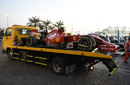 Fernando Alonso's Ferrari returns to the paddock after an electrical problem