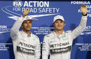 Lewis Hamilton and Nico Rosberg acknowledge the crowd in parc ferme