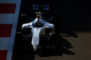 Valtteri Bottas drives through the shadows in qualifying