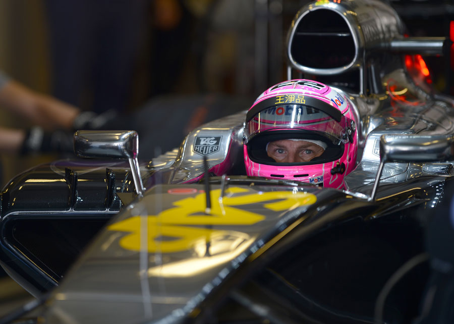 Jenson Button watches proceedings in qualifying from his cockpit