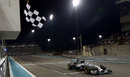 Lewis Hamilton crosses the line to win the world championship in style