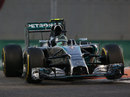 Nico Rosberg bounces over the kerbs