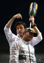 Toto Wolff celebrates with Lewis Hamilton on the podium