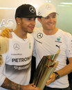 Lewis Hamilton and Nico Rosberg pose for the cameras after the conclusion of their title battle