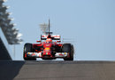 Kimi Raikkonen exits the pits in the Ferrari